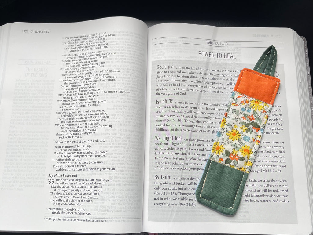 Garden Blessing quilted bookmark resting in an open Bible
