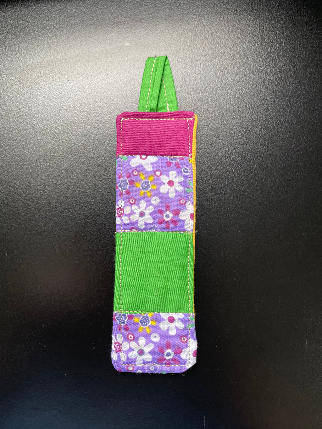 Meadow Prayer handmade quilted bookmark with purple and green floral cotton fabric and yellow backing