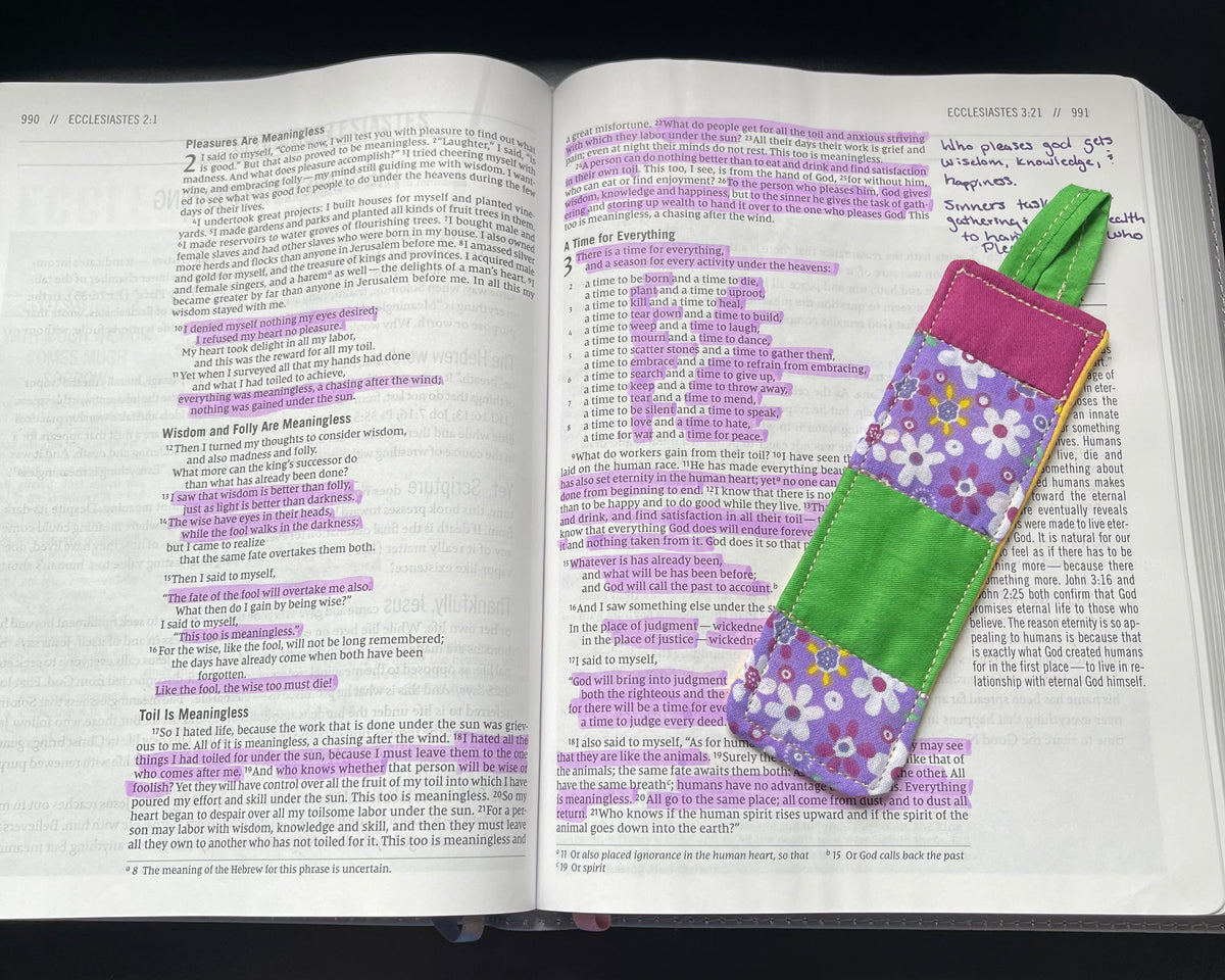 Meadow Prayer quilted bookmark resting in an open Bible