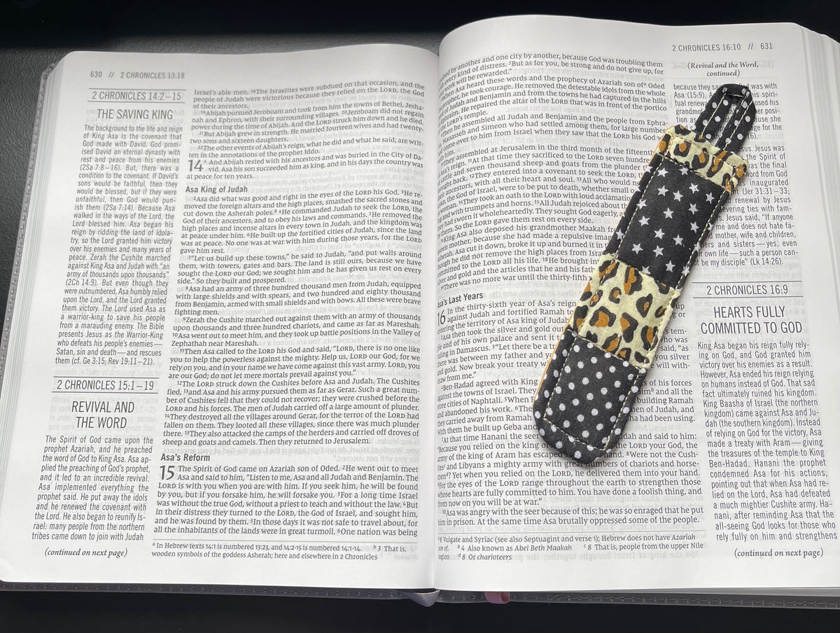 Wild Grace quilted bookmark resting in an open Bible
